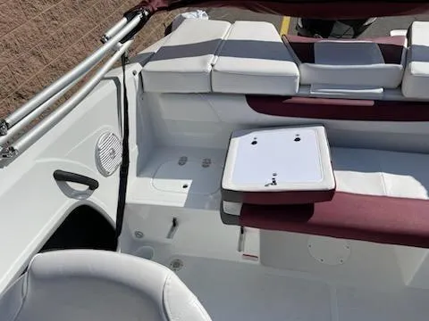 Slide: The Image of 2024 Tahoe 185 S boat interior with white and maroon seating. - 3