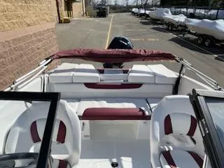 Slide: The Image of 2024 Tahoe 185 S boat interior with red and white seating. - 4