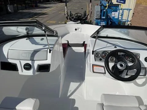 Slide: The Image of 2024 Tahoe 185 S boat interior with steering wheel and dashboard. - 5