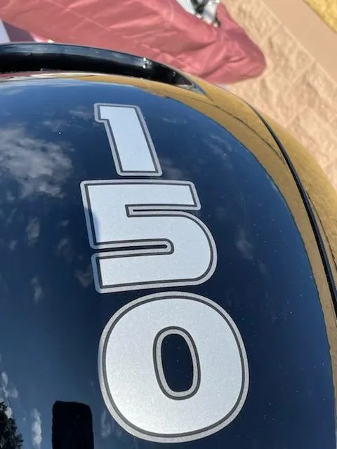 Slide: The Image of Close-up of 2024 Tahoe 185 S boat engine with 150 decal. - 7