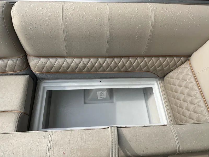 Slide: The Image of 2024 Ranger Reata 220C pontoon boat with spacious seating and modern design. - 10