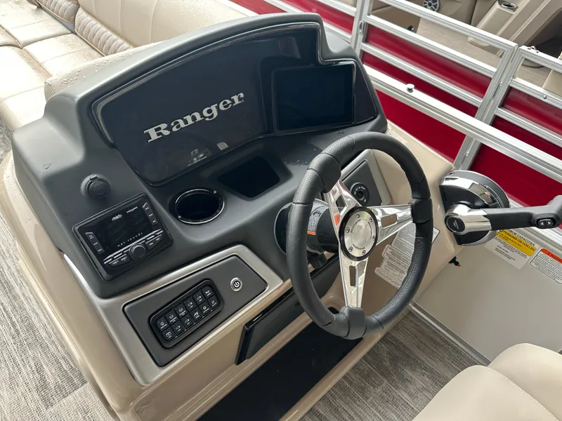 Slide: The Image of 2024 Ranger Reata 220C boat with luxurious beige seating and quilted accents. - 13