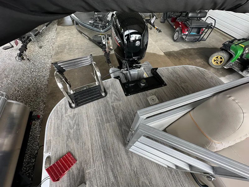 Slide: The Image of 2024 Ranger Reata 220C boat interior with beige seating and cup holder. - 17