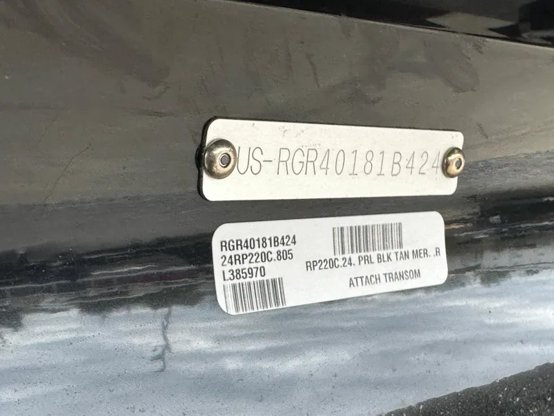 Slide: The Image of 2024 Ranger Reata 220C boat storage compartment with open lid, showcasing interior space. - 18