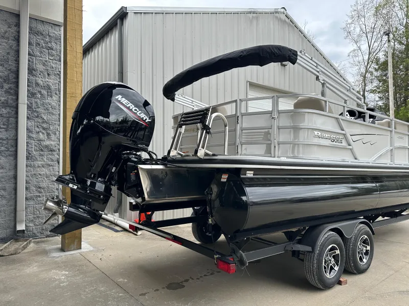 Slide: The Image of 2024 Ranger Reata 220C pontoon boat with Mercury engine on trailer. - 3