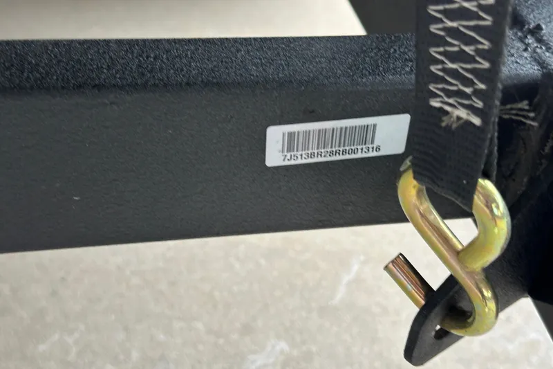 Slide: The Image of 2024 Ranger Reata 220C trailer hitch with barcode and safety strap. - 30