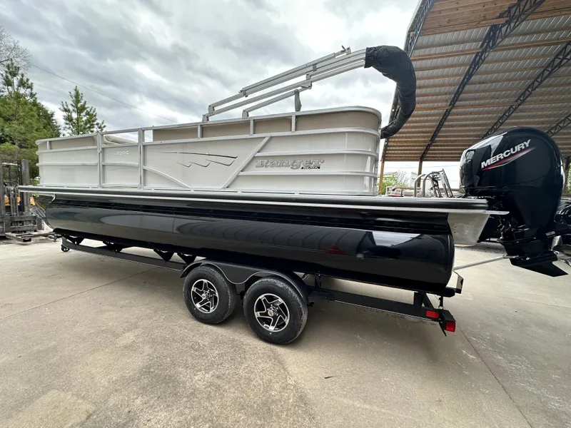 Slide: The Image of 2024 Ranger Reata 220C pontoon boat on trailer in covered storage area. - 5