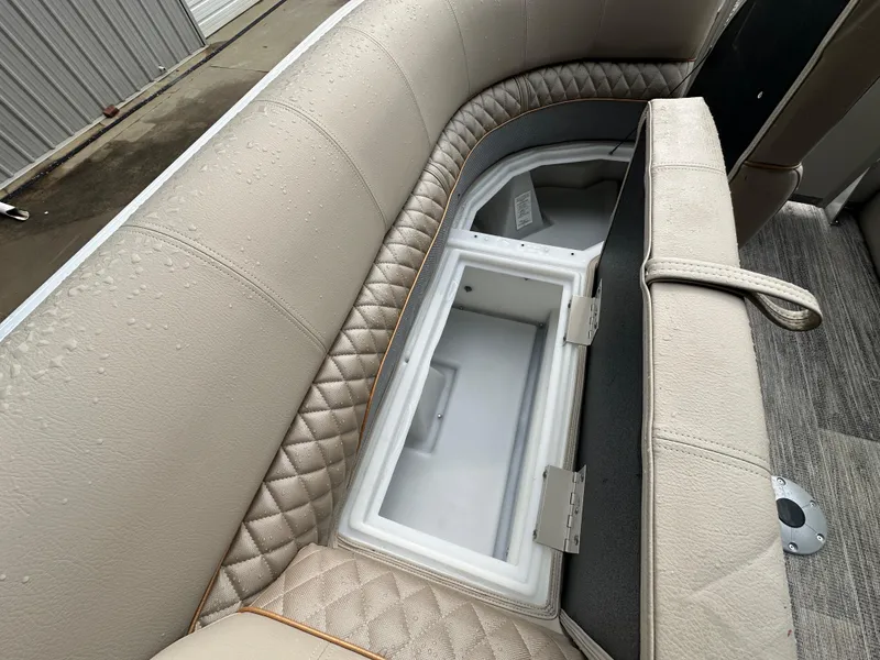 Slide: The Image of 2024 Ranger Reata 220C boat seat with storage compartment, featuring quilted beige upholstery. - 8