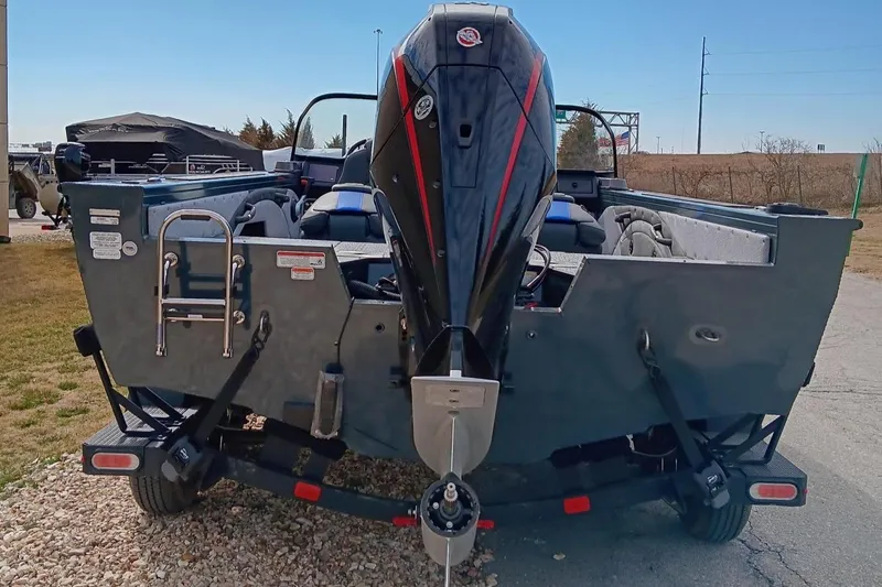 Slide: The Image of 2024 Ranger VX1988 WT boat rear view with outboard motor and trailer. - 3