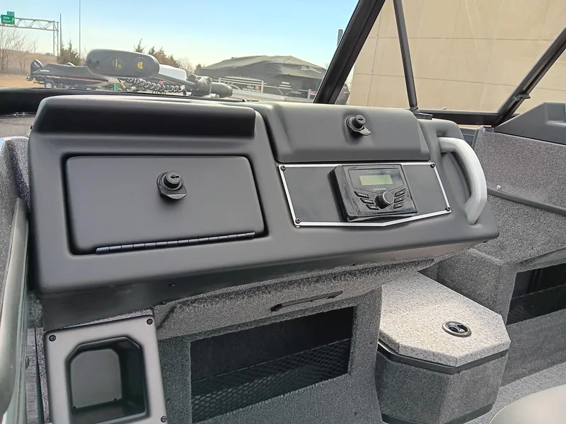 Slide: The Image of Dashboard of 2024 Ranger VX1988 WT boat with control panel and storage compartments. - 4