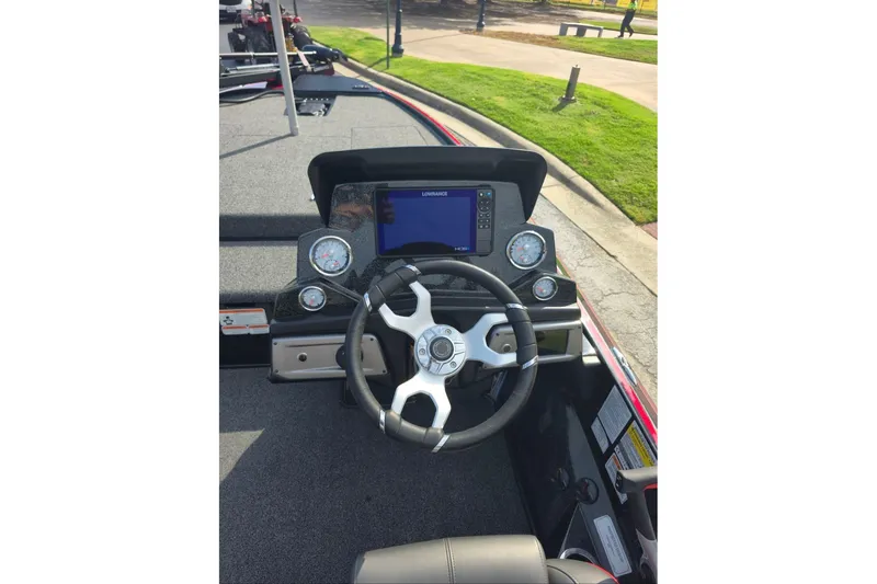 Slide: The Image of 2024 Nitro Z19 boat dashboard with steering wheel and digital display. - 3