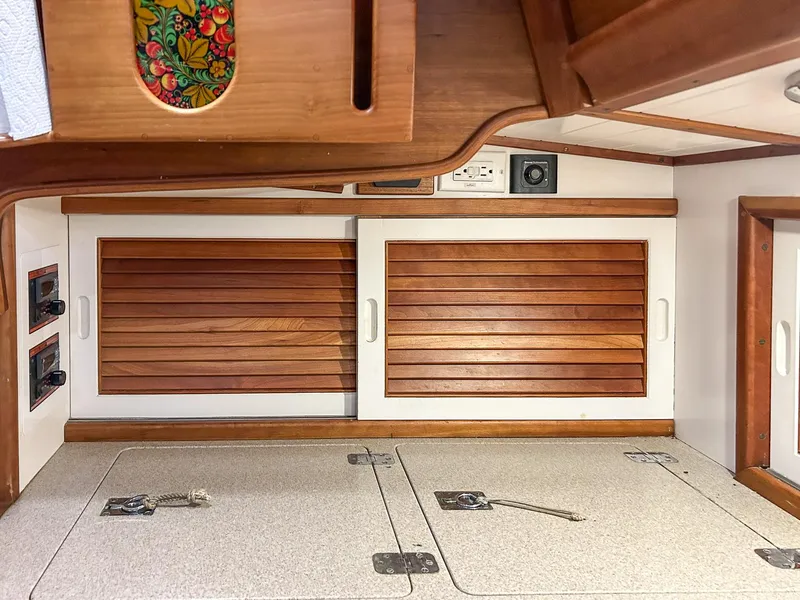 Slide: The Image of Galley of 1996 Hinckley Sou'wester 42 MKII with stove, sink, and wooden cabinetry. - 18