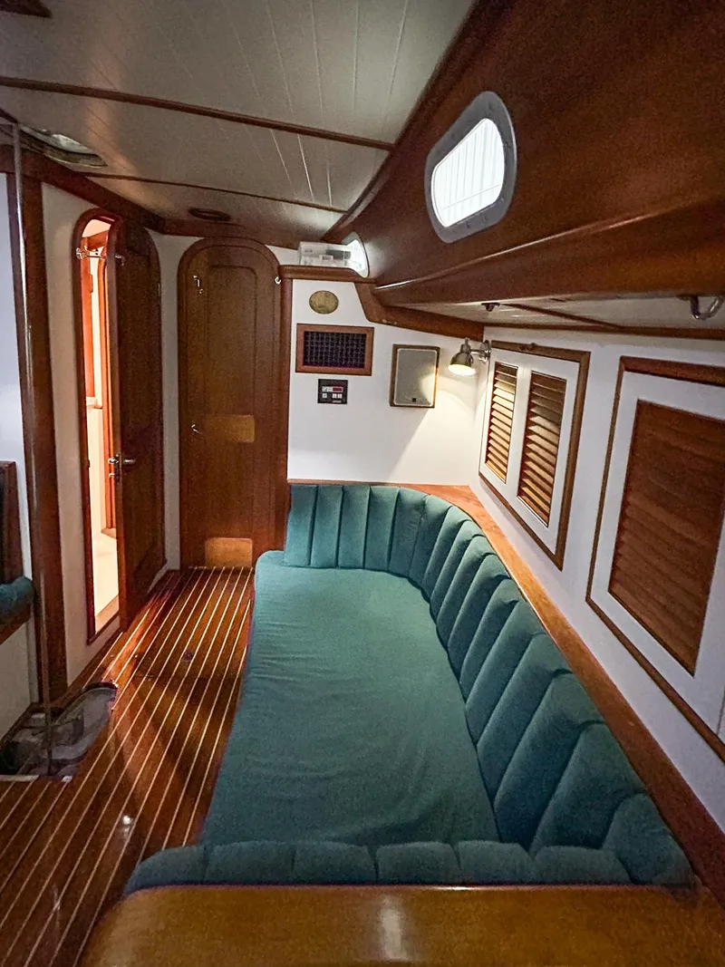 Slide: The Image of 1996 Hinckley Sou'wester 42 MKII yacht kitchen with stainless steel sink and wooden cabinetry. - 20
