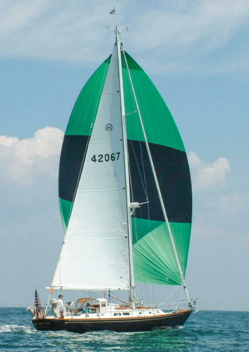 Slide: The Image of Hinckley Sou'wester 42 MKII sailboat from 1996 on calm blue water. - 3