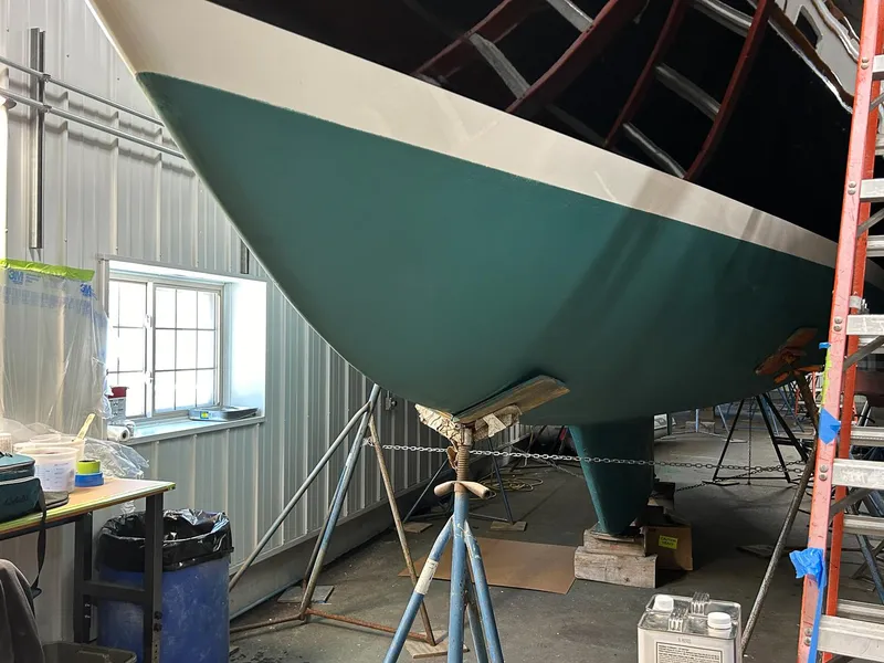 Slide: The Image of Hinckley Sou'wester 42 MKII 1996 cabin interior with wood paneling and porthole. - 39