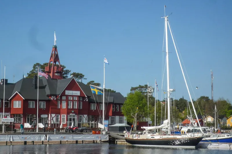 Slide: The Image of Hinckley Sou'wester 42 MKII 1996 sailboat in dry dock, showcasing sleek hull design. - 45