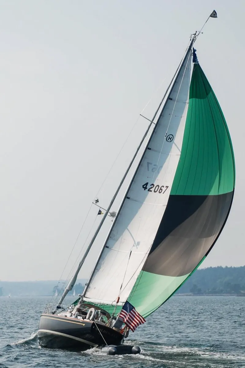 Slide: The Image of Sailing yacht Hinckley Sou'wester 42 MKII, 1996, with colorful spinnaker on open water. - 53