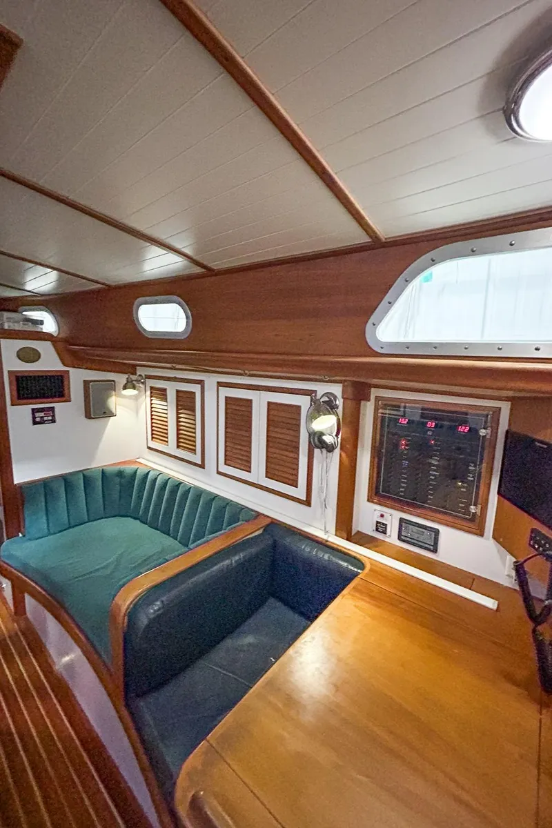 Slide: The Image of Interior of 1996 Hinckley Sou'wester 42 MKII yacht, featuring a well-equipped kitchen area. - 21