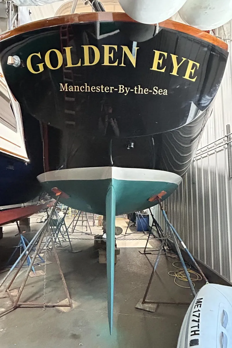 Slide: The Image of Hinckley Sou'wester 42 MKII sailboat in a workshop, 1996 model, undergoing maintenance. - 43