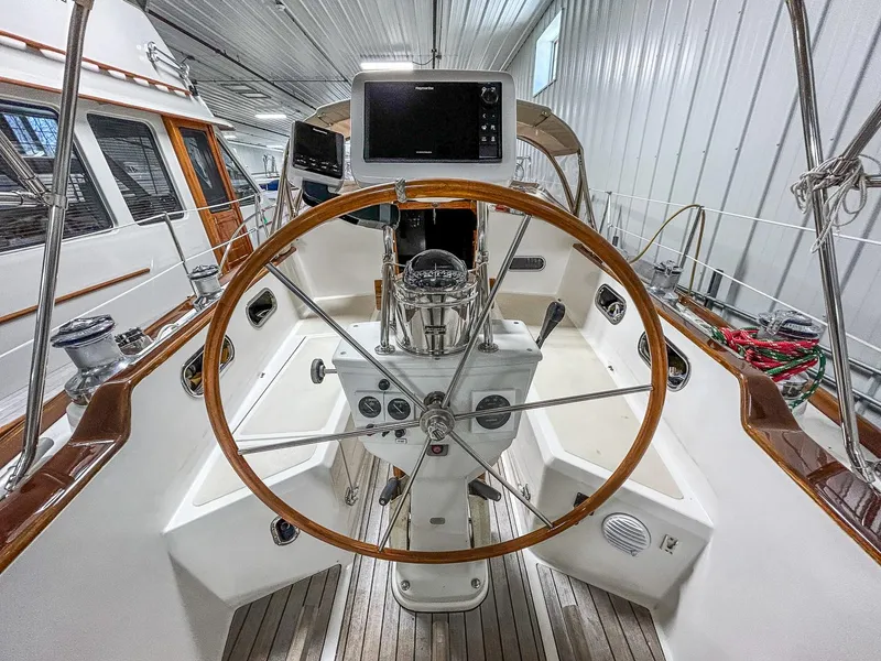 Slide: The Image of Sailing yacht Hinckley Sou'wester 42 MKII, 1996, with green and black sails on open water. - 7