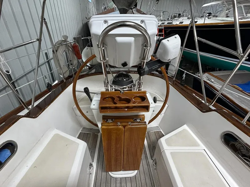 Slide: The Image of Sailboat Hinckley Sou'wester 42 MKII, 1996, anchored in a rocky cove with clear water. - 8