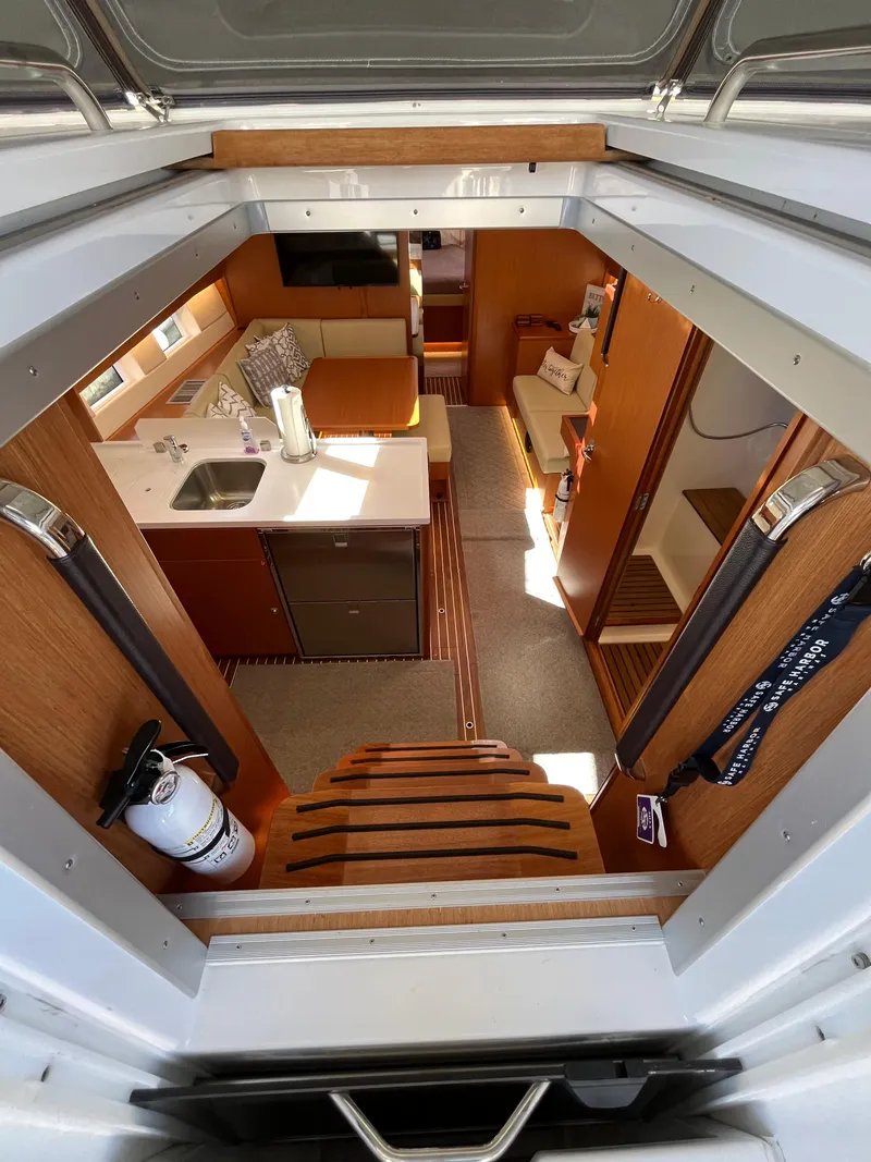 Slide: The Image of Interior of 2021 Bavaria C45 sailboat with modern kitchen and cozy living area. - 29