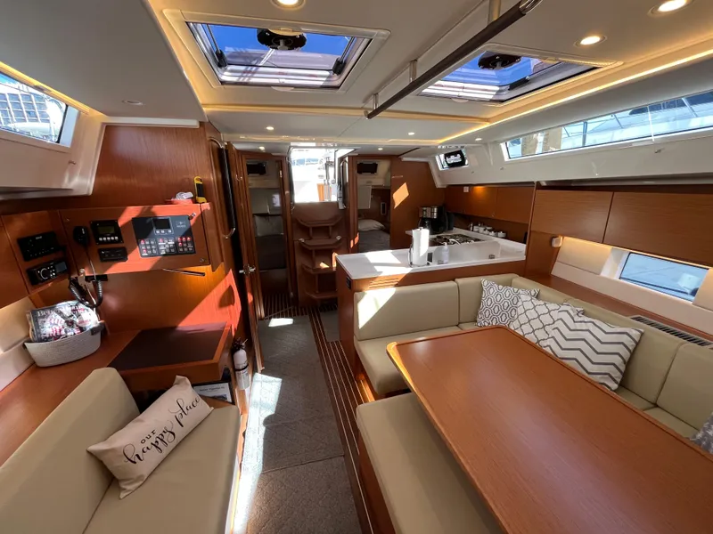 Slide: The Image of Interior of 2021 Bavaria C45 sailboat with modern kitchen and cozy seating area. - 30