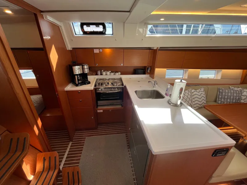 Slide: The Image of Modern kitchen and dining area inside a 2021 Bavaria C45 sailboat. - 32