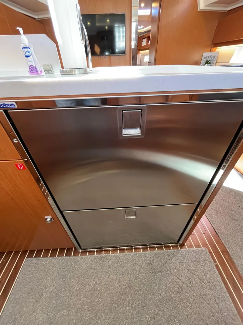 Slide: The Image of Modern kitchen area in a 2021 Bavaria C45 yacht with stainless steel appliances. - 33
