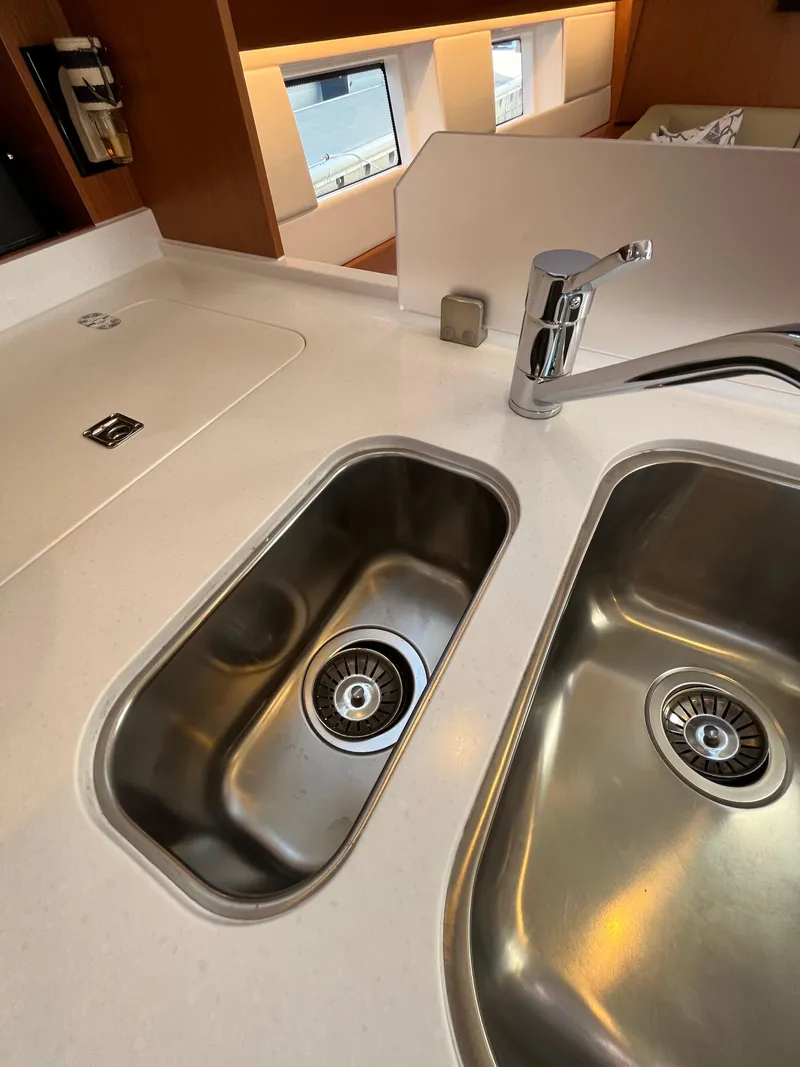 Slide: The Image of Modern kitchen sink area in a 2021 Bavaria C45 yacht. - 36