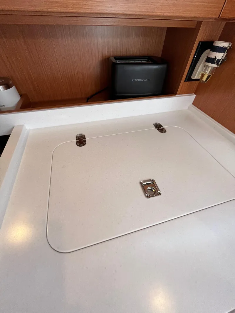 Slide: The Image of 2021 Bavaria C45 yacht kitchen counter with built-in storage and appliances. - 37