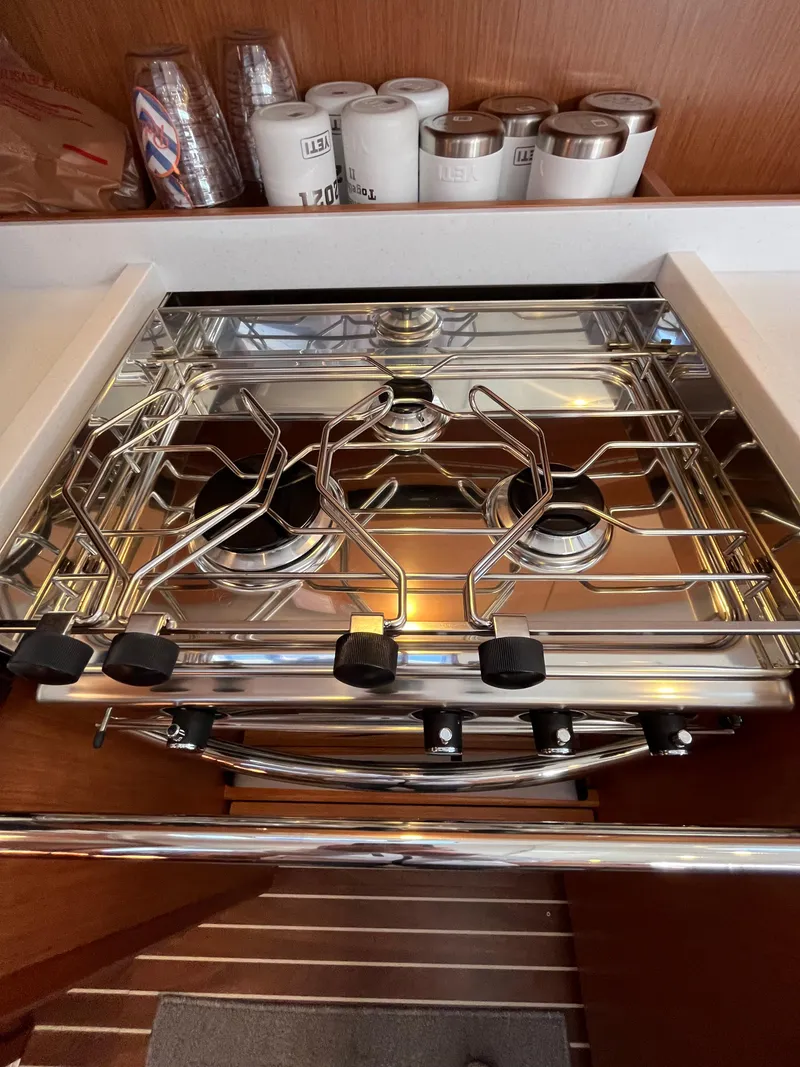 Slide: The Image of Modern stainless steel stove in the 2021 Bavaria C45 yacht kitchen. - 39