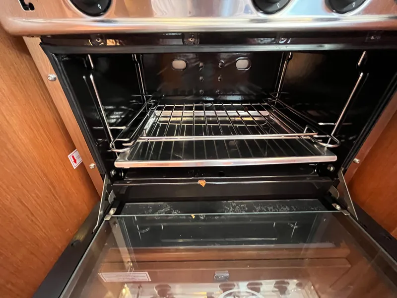 Slide: The Image of Open oven in a 2021 Bavaria C45 yacht kitchen. - 41