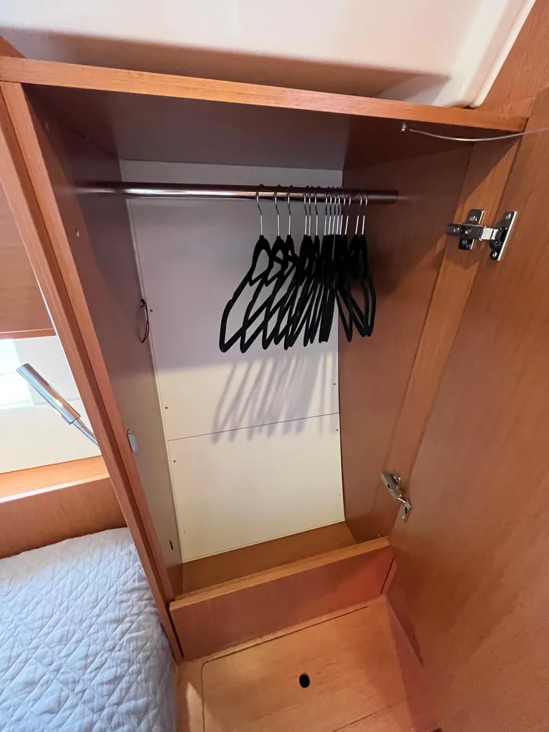 Slide: The Image of Wooden closet with hangers inside Bavaria C45 yacht, 2021 model. - 47