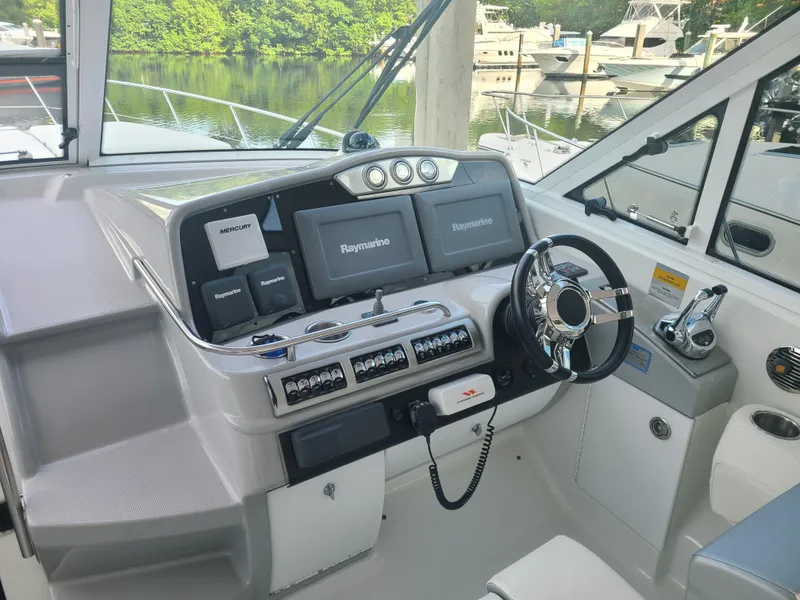 Slide: The Image of 2007 Formula 45 Yacht helm with navigation systems and steering wheel. - 11