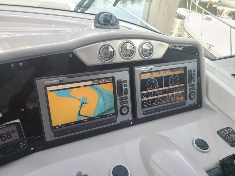 Slide: The Image of Dashboard of a 2007 Formula 45 Yacht with dual navigation screens. - 13