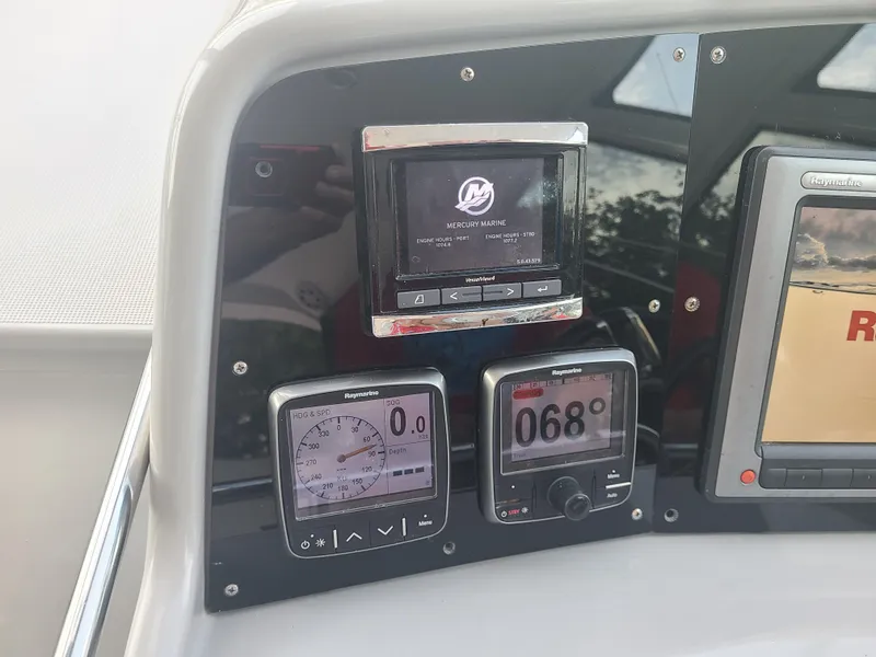 Slide: The Image of Control panel of a 2007 Formula 45 Yacht with digital displays. - 15