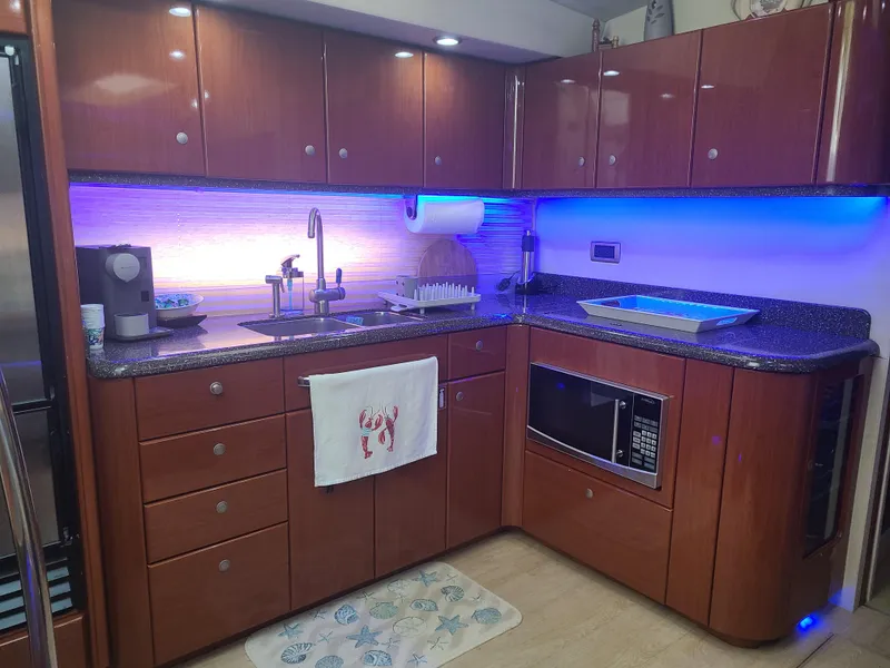 Slide: The Image of Modern kitchen in 2007 Formula 45 Yacht with wood cabinets and blue LED lighting. - 24
