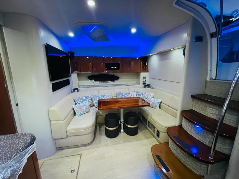 Slide: The Image of Interior of a 2007 Formula 45 Yacht with modern seating and blue ambient lighting. - 26