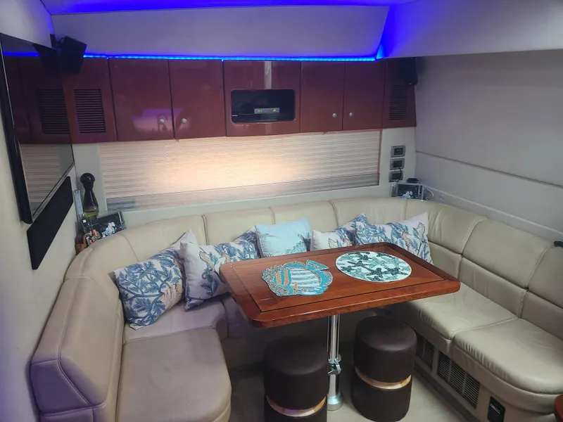 Slide: The Image of Luxurious interior of 2007 Formula 45 Yacht with plush seating and elegant wooden table. - 27