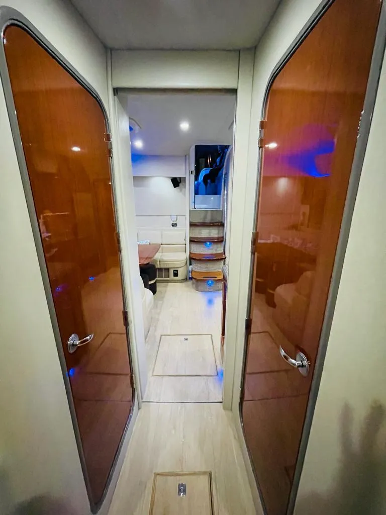 Slide: The Image of Interior hallway of a 2007 Formula 45 Yacht with wooden doors and modern lighting. - 28