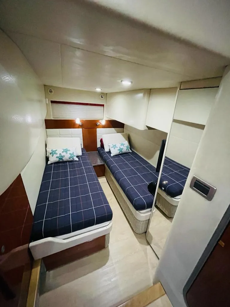 Slide: The Image of 2007 Formula 45 Yacht cabin with twin beds and modern interior design. - 29