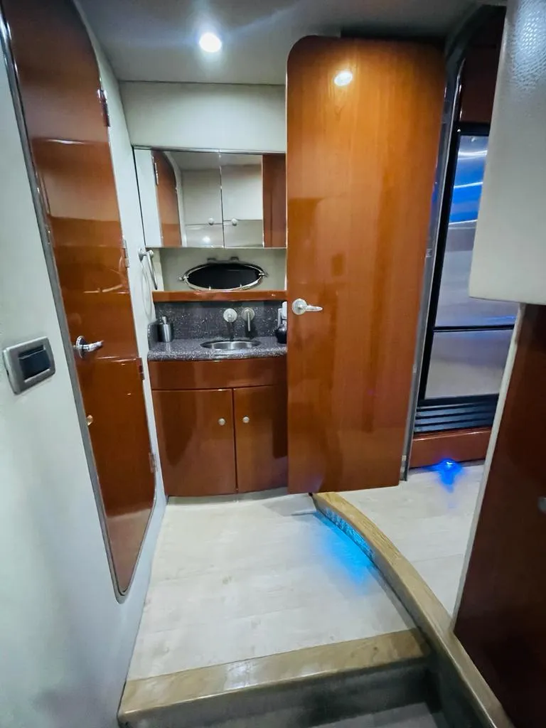 Slide: The Image of Interior of 2007 Formula 45 Yacht with wooden cabinetry and modern fixtures. - 31