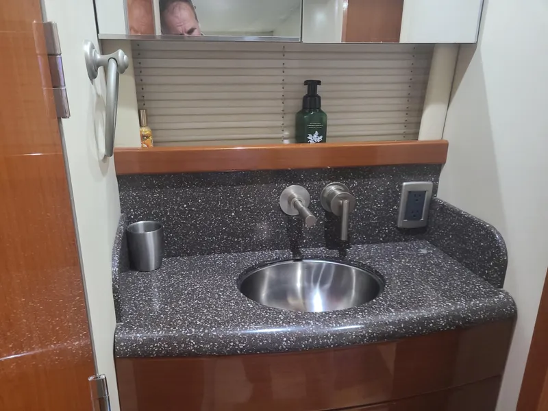 Slide: The Image of Bathroom sink area in a 2007 Formula 45 Yacht with granite countertop. - 32