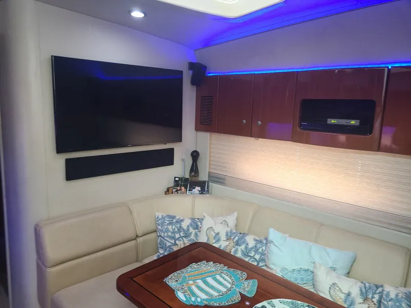 Slide: The Image of Interior of 2007 Formula 45 Yacht with TV, seating, and decorative pillows. - 33