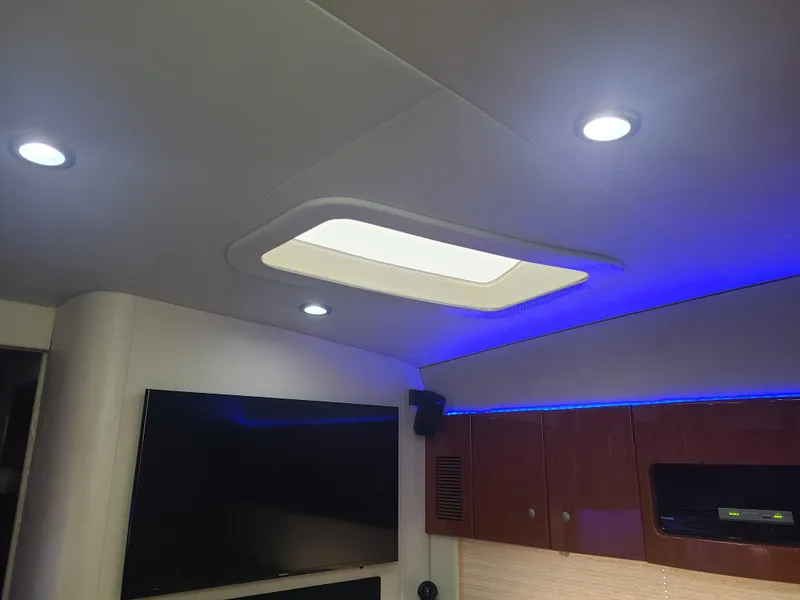 Slide: The Image of Interior of 2007 Formula 45 Yacht with skylight, LED lighting, and wooden cabinets. - 34