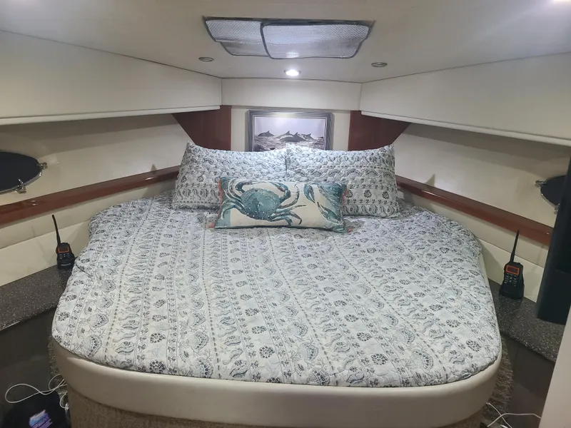 Slide: The Image of Luxurious bedroom in a 2007 Formula 45 Yacht with a cozy bed and marine-themed decor. - 36