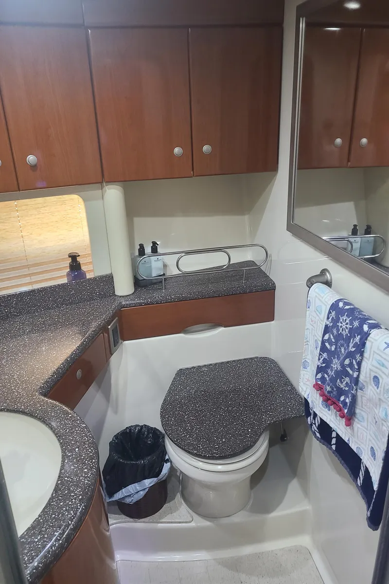 Slide: The Image of 2007 Formula 45 Yacht bathroom with modern fixtures and wooden cabinetry. - 38