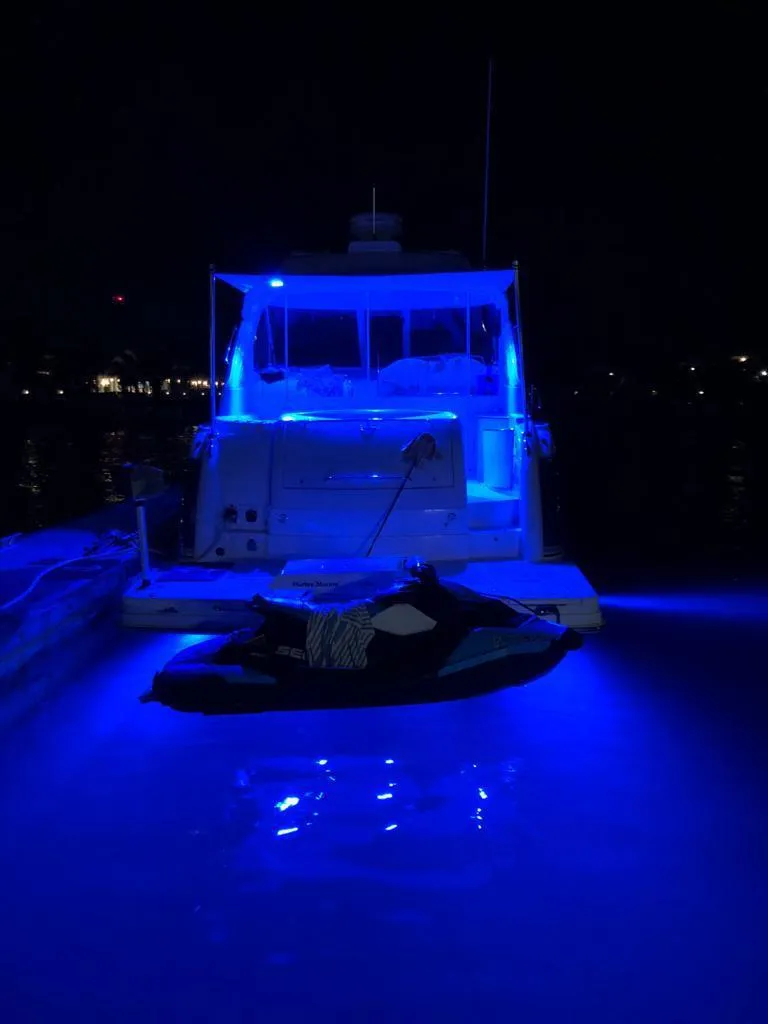 Slide: The Image of 2007 Formula 45 Yacht illuminated with blue lights at night. - 43