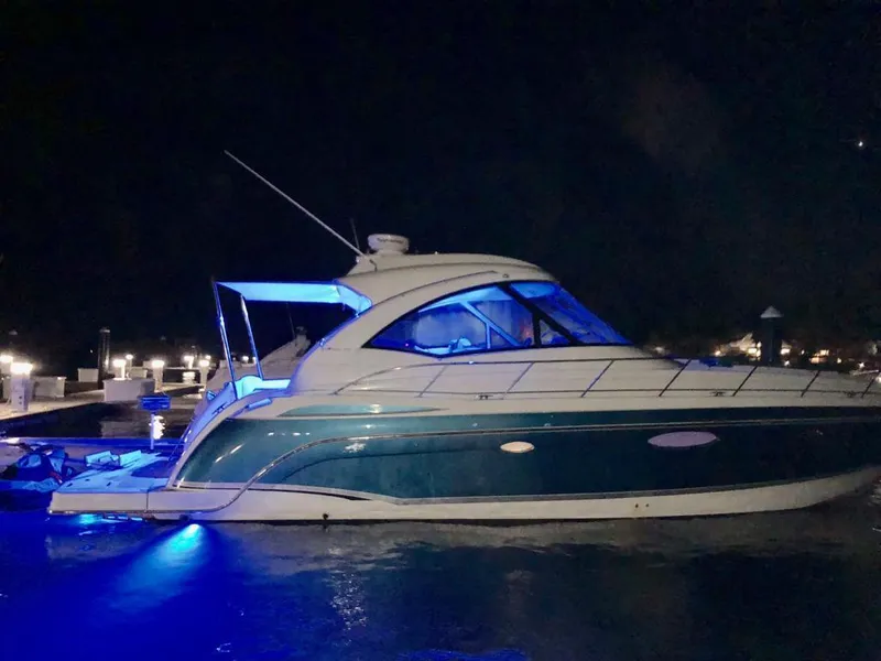 Slide: The Image of 2007 Formula 45 Yacht illuminated at night with blue lights. - 44